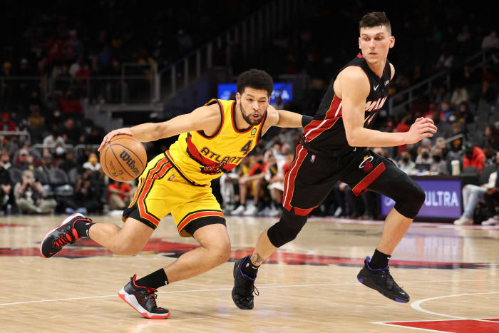 Jan 12, 2022; Atlanta, Georgia, USA; Atlanta Hawks guard Skylar Mays (4) drives against Miami Heat guard Tyler Herro (14) during the fourth quarter at State Farm Arena.